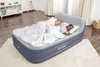 Two people sleeping on an inflatable air mattress in a bedroom. Podgląd zdjęcia produktu