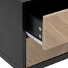 Close-up view of an open drawer on a black nightstand with a wood-patterned drawer front. Podgląd zdjęcia produktu