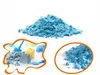 A collage of images showing blue kinetic sand, some with sand toys. Voir les images du produit