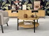 A living room scene with a coffee table, armchair, and a credenza against a floral wallpaper. Náhľad obrázku produktu