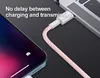 A close-up shot of a pink braided USB-C charging cable connecting a smartphone to a laptop. Produktbild-Vorschau