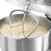 Close-up of a stand mixer's mixing bowl and beater with batter. Produktbild-Vorschau