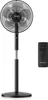A black standing fan and a black remote control are displayed on a white background. Voir les images du produit