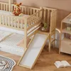A wooden bunk bed with a slide and a stuffed animal on the top bunk, set in a child's room. Podgląd zdjęcia produktu