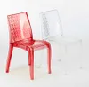 Two transparent chairs, one red and one clear, are shown against a white background. Anteprima dell’immagine prodotto