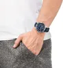 A person's wrist wearing a watch, with their hand in their pocket. Náhľad obrázku produktu