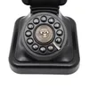 A close-up studio shot of a black retro rotary dial telephone. Podgląd zdjęcia produktu