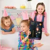 Three young girls at a birthday party, one holding an advent calendar. Náhled obrázku produktu