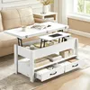 A white lift-top coffee table with storage is shown in a living room setting next to a sofa. Produktbild-Vorschau