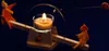 A candle-powered kinetic sculpture with two small figures on a seesaw. Anteprima dell’immagine prodotto