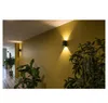 A hallway with plants and wall lights. Produktbild-Vorschau