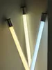 Three LED light tubes of different color temperatures are shown against a light gray background. Produktbild-Vorschau