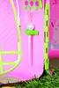 A close-up view of a toy cottage interior, showing accessories like keys and a small stand with a ball. Produktbild-Vorschau