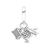 A silver charm with three travel-themed pendants: an airplane, a globe, and a suitcase. Podgląd zdjęcia produktu