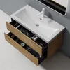 A bathroom vanity with a sink and open drawers filled with toiletries. Produktbild-Vorschau