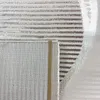 Close-up view of a rug with a striped pattern. Produktbild-Vorschau