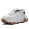 A single white Guess sneaker is shown against a white background. Náhled obrázku produktu