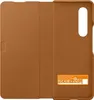 The back of a brown leather phone case with regulatory information printed on it. Produktbild-Vorschau