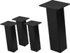 Four black metal table legs are arranged on a white background. Three legs are grouped together on the left, and one larger leg is positioned to the right. Náhľad obrázku produktu