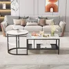 A living room scene with a sofa, coffee table, and side table. Voir les images du produit