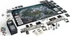 A tabletop board game setup, featuring a large map of Skyrim, numerous cards, tokens, and miniature figures, arranged on a white surface. Podgląd zdjęcia produktu