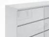 A close-up view of a white, high-gloss dresser with multiple drawers. Produktbild-Vorschau