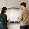 A couple cooking together in a modern kitchen, with steam rising from pots on an induction hob. Náhľad obrázku produktu