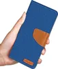 A hand holding a blue flip case for a phone. Produktbild-Vorschau