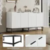 A white cabinet with vertical grooved doors sits on black metal legs, with decorative items on top. Inset images highlight the black metal legs and the black matte metal handles. Anteprima dell’immagine prodotto