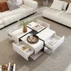 A modern living room with a white sectional sofa and a white coffee table with drawers. Produktbild-Vorschau