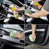 Four images showing the steps of cleaning a car interior with a spray bottle and microfiber cloths. Produktbild-Vorschau