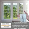 A hand holding a white string curtain in front of French doors with a garden view. Náhľad obrázku produktu