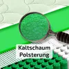 A close-up view of mattress material, showing its internal structure through a magnifying glass. Produktbild-Vorschau