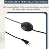 A close-up of a floor lamp's foot switch and power cord. Podgląd zdjęcia produktu