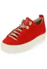 A single red sneaker with beige laces and a white sole is shown against a white background. Náhľad obrázku produktu