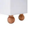 A close-up view of the bottom of a white cabinet with two round wooden legs. Anteprima dell’immagine prodotto