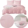 A collage of images showing pink striped bedding, including a duvet and pillowcases, with close-up details.