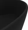 A close-up view of the edge of a black ceramic sink. Náhled obrázku produktu