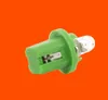 A single green plastic-based light bulb with a clear glass bulb, set against an orange background. Produktbild-Vorschau