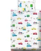 A flat lay of a white duvet cover and pillowcase with a colorful cartoon pattern of various vehicles. Produktbild-Vorschau