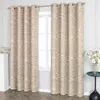 Two curtains with a white abstract pattern are hanging on a curtain rod in front of a window. A small white cabinet with a calendar is to the left, and a small blue table with a vase of flowers is to the right. Produktbild-Vorschau