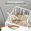 A white clothes drying rack with clothes on it, showing airflow arrows indicating breathability. Produktbild-Vorschau