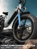 Close-up of the front fork and wheel of a gray electric bicycle, with a rocky terrain and sky in the background. Produktbild-Vorschau