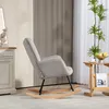 A light gray corduroy rocking chair with wooden rockers is placed in a living room setting next to a wooden side table with a plant and fruit bowl. Anteprima dell’immagine prodotto
