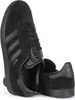 A pair of black Adidas Gazelle sneakers shown from a close-up angle. Voir les images du produit