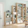 A room interior with multiple bookshelves filled with decorative items and books. Produktbild-Vorschau