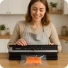 A woman is using a vacuum sealer machine to seal a piece of salmon. Anteprima dell’immagine prodotto