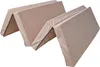 A folded beige mattress is shown from a diagonal angle. Anteprima dell’immagine prodotto