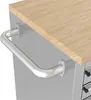 A close-up view of a metal handle attached to a grey cabinet with a wooden top. Produktbild-Vorschau