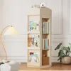 A rotating bookshelf filled with books and a teddy bear on top, placed in a room with a floor lamp and a plant. Produktbild-Vorschau